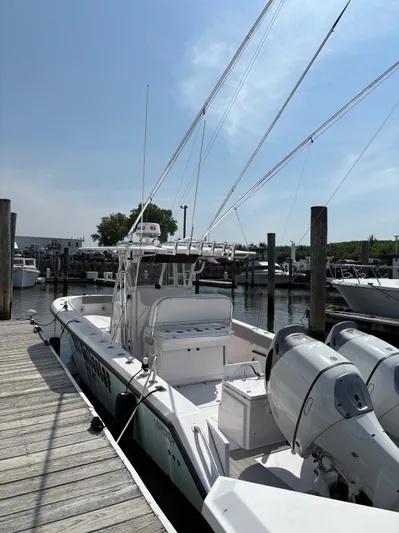  Yacht Photos Pics 2009 Venture 34 CC boat docked at marina with dual outboard engines.