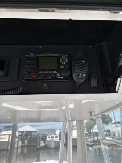  Yacht Photos Pics VHF marine radio setup on 2009 Venture 34 CC boat dashboard.