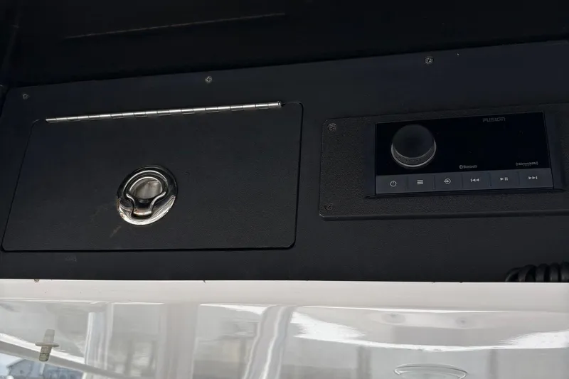  Yacht Photos Pics Control panel and storage compartment on a 2009 Venture 34 CC boat.