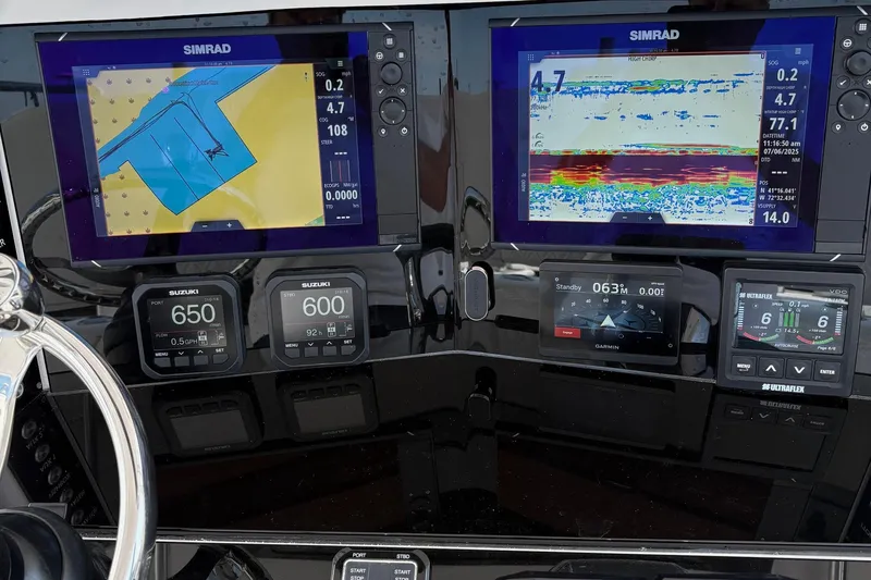  Yacht Photos Pics Boat dashboard with Simrad navigation displays on a 2009 Venture 34 CC.