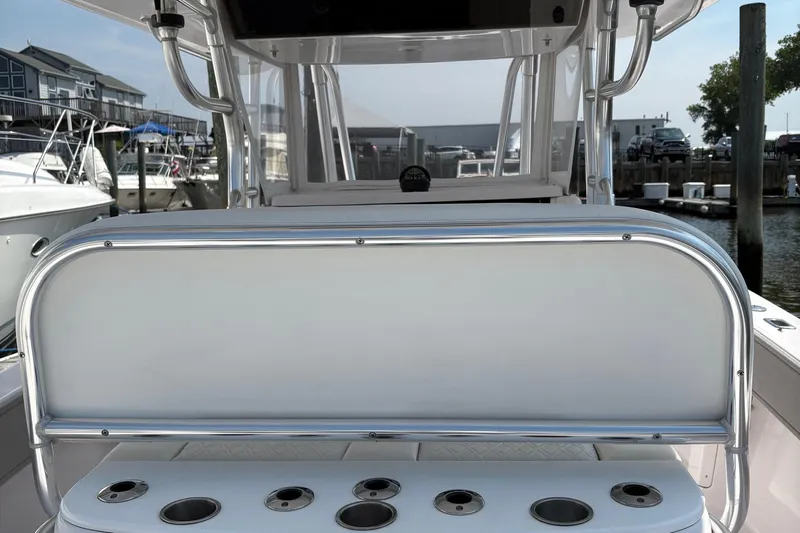  Yacht Photos Pics 2009 Venture 34 CC boat interior with rod holders, docked at marina.