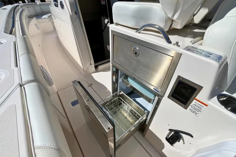 Perseverance Yacht Photos Pics 2019 Pursuit S 368 Sport boat interior with stainless steel grill and seating area.