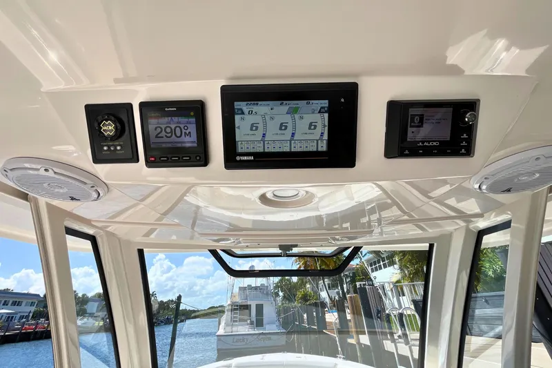 Perseverance Yacht Photos Pics 2019 Pursuit S 368 Sport dashboard with navigation and audio controls.