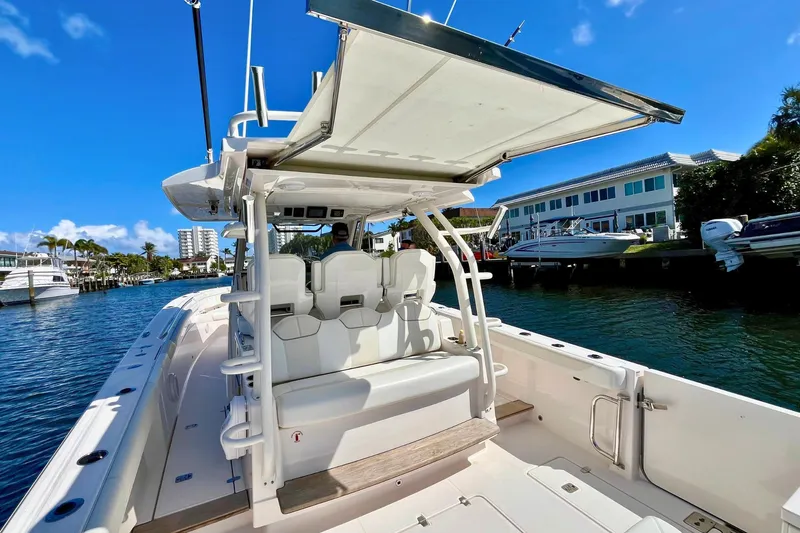 Perseverance Yacht Photos Pics 2019 Pursuit S 368 Sport boat docked, featuring sleek design and spacious seating.