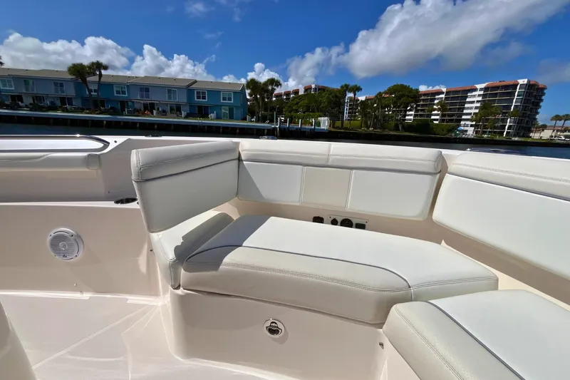 Perseverance Yacht Photos Pics 2019 Pursuit S 368 Sport boat interior with white seating, dockside view.