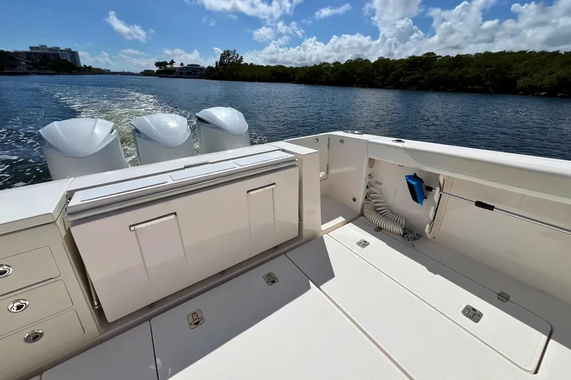 Perseverance Yacht Photos Pics 2019 Pursuit S 368 Sport boat deck with triple engines on a sunny day.