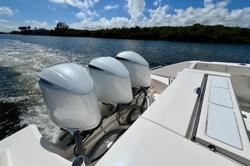 Perseverance Yacht Photos Pics 2019 Pursuit S 368 Sport boat with triple outboard engines on a sunny day.