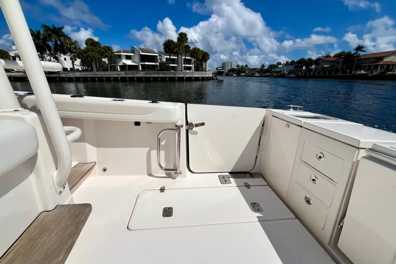 Perseverance Yacht Photos Pics 2019 Pursuit S 368 Sport boat interior with waterfront view, clear skies, and modern design.
