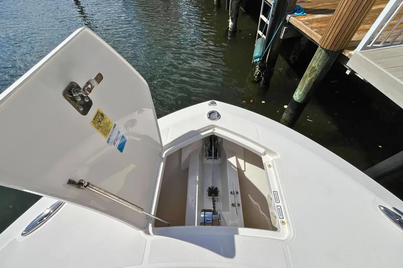 Perseverance Yacht Photos Pics 2019 Pursuit S 368 Sport boat anchor compartment open at dockside.