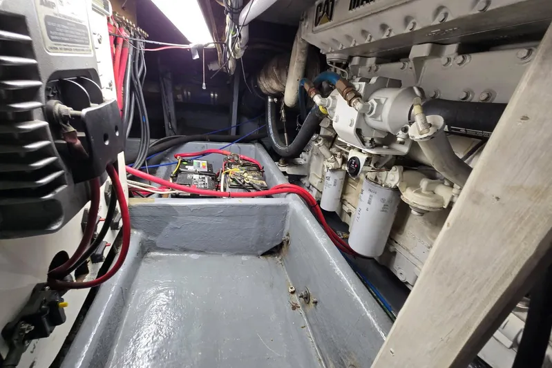 Sunrise Yacht Photos Pics Engine room of a 1995 MDI Downeast boat, featuring mechanical components and wiring.