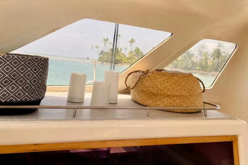  Yacht Photos Pics Interior view of 1998 Voyager Norseman 430 yacht with ocean and palm trees outside.