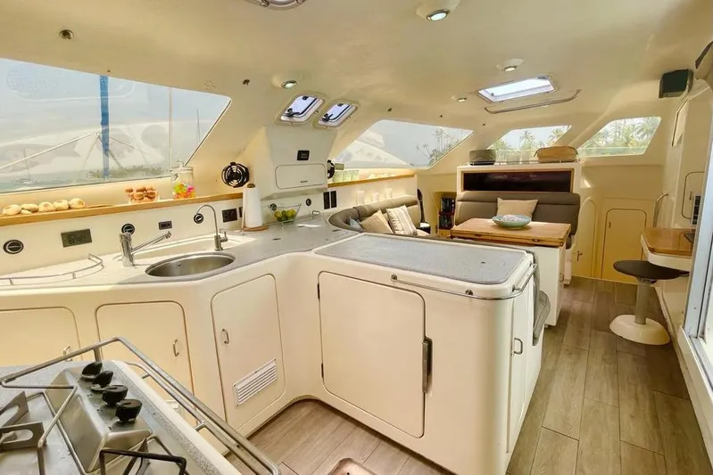  Yacht Photos Pics Spacious interior of 1998 Voyager Norseman 430 yacht with modern kitchen and seating area.