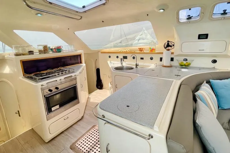  Yacht Photos Pics Interior of 1998 Voyager Norseman 430 yacht with modern kitchen and seating area.