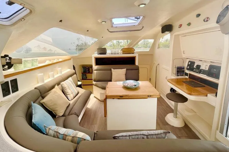  Yacht Photos Pics Interior of 1998 Voyager Norseman 430 yacht with cozy seating and navigation station.