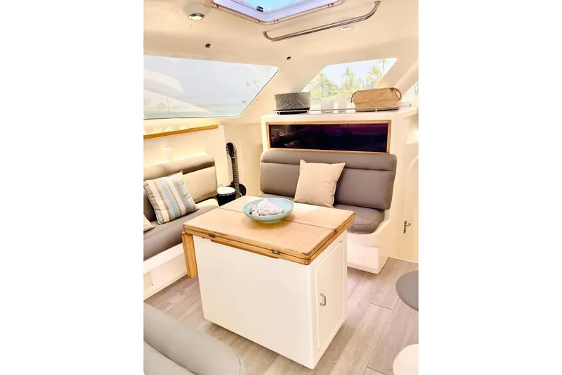  Yacht Photos Pics Cozy interior of 1998 Voyager Norseman 430 yacht with seating and table.