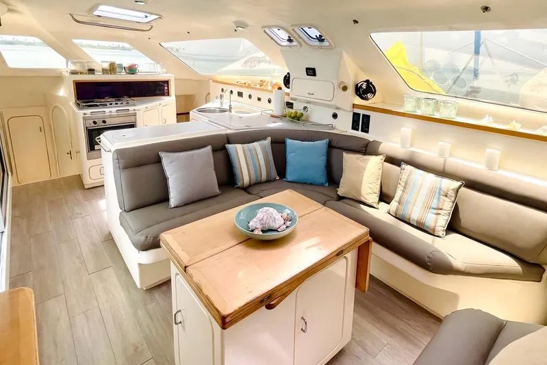  Yacht Photos Pics Spacious interior of 1998 Voyager Norseman 430 yacht with cozy seating and modern kitchen.