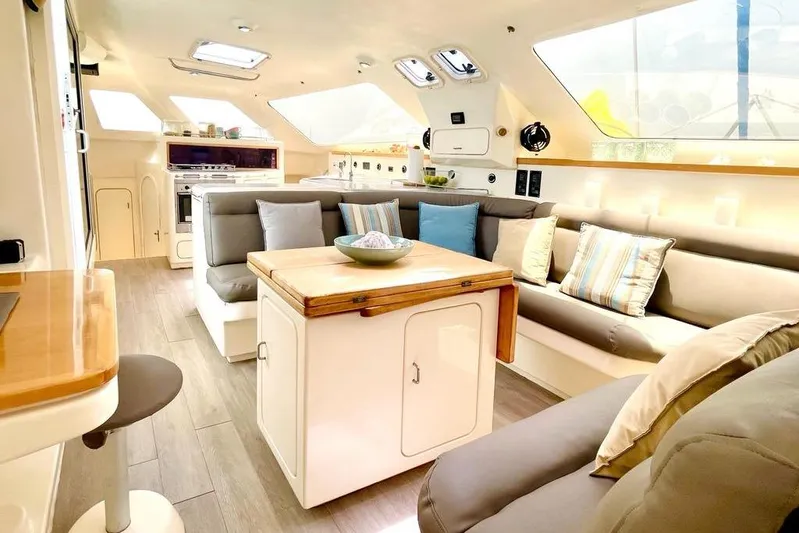  Yacht Photos Pics Luxurious interior of 1998 Voyager Norseman 430 yacht with modern seating and decor.