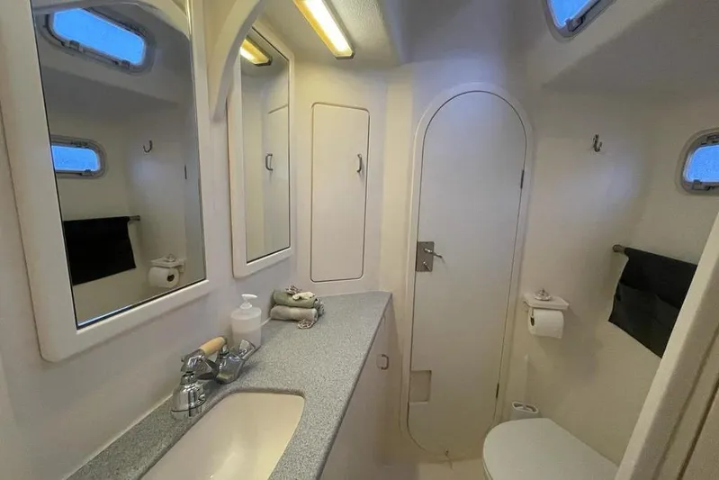  Yacht Photos Pics Luxurious bathroom in 1998 Voyager Norseman 430 yacht with modern fixtures and ample lighting.