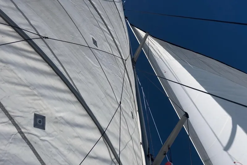  Yacht Photos Pics Close-up of sails on a 1998 Voyager Norseman 430 against a clear blue sky.