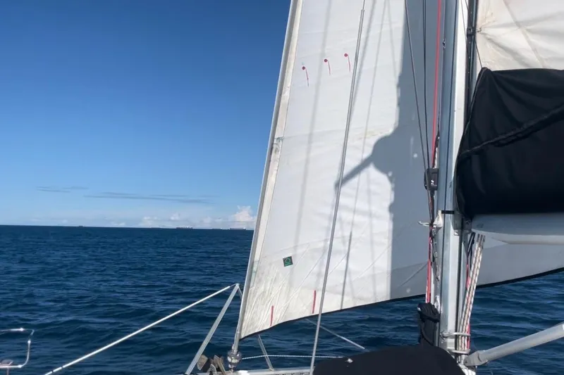  Yacht Photos Pics Sailing on a 1998 Voyager Norseman 430 yacht with clear blue skies and ocean.