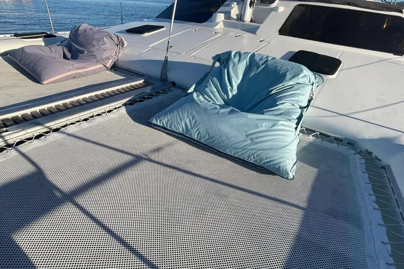  Yacht Photos Pics Deck of 1998 Voyager Norseman 430 with cushions on netting, ocean view.