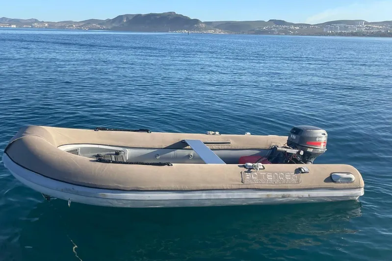  Yacht Photos Pics Inflatable boat Voyager Norseman 430 (1998) with outboard motor on calm sea.