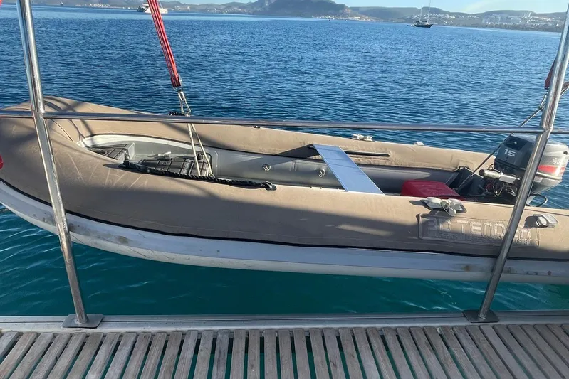  Yacht Photos Pics Inflatable boat Voyager Norseman 430, 1998 model, docked on a wooden pier by the sea.