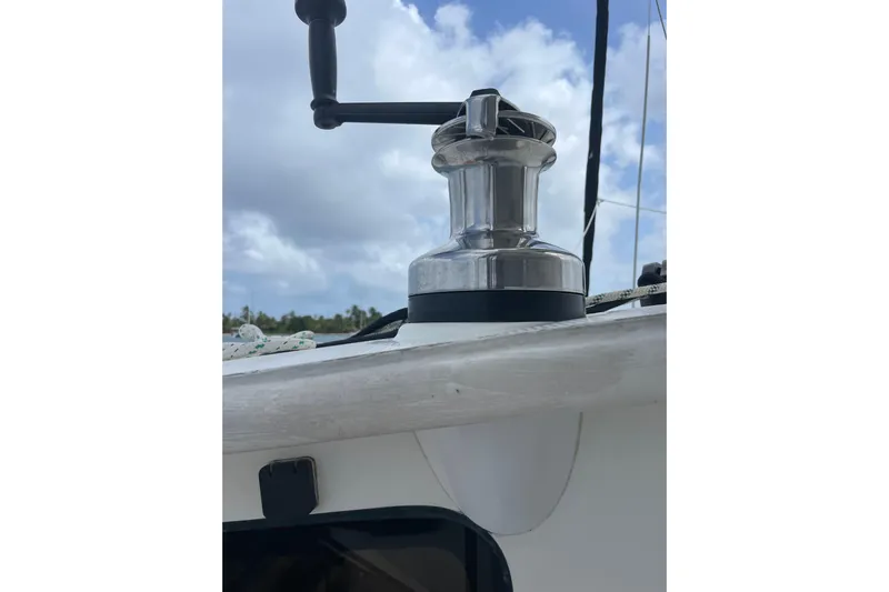  Yacht Photos Pics Winch on 1998 Voyager Norseman 430 sailboat against cloudy sky.