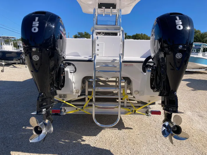  Yacht Photos Pics 2025 Twin Vee 260STX boat with dual 150 horsepower engines and rear ladder.