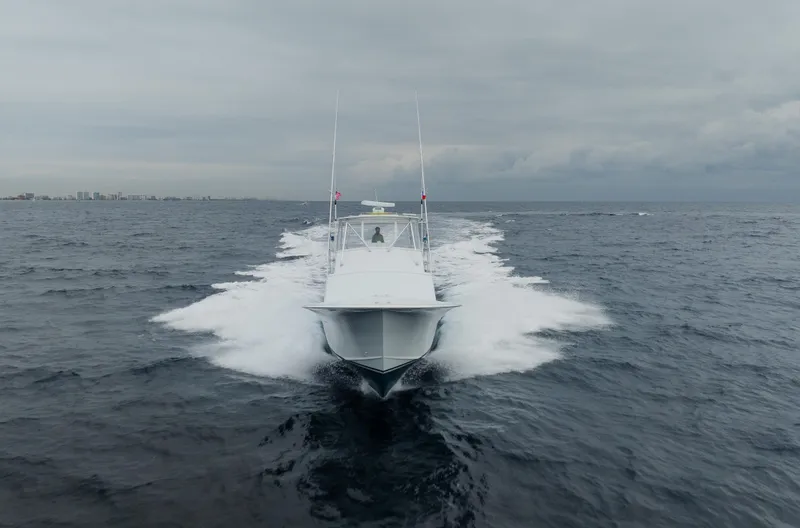 Sea Angel Yacht Photos Pics 1980 Scarborough 46 Convertible yacht cruising on open sea under cloudy skies.