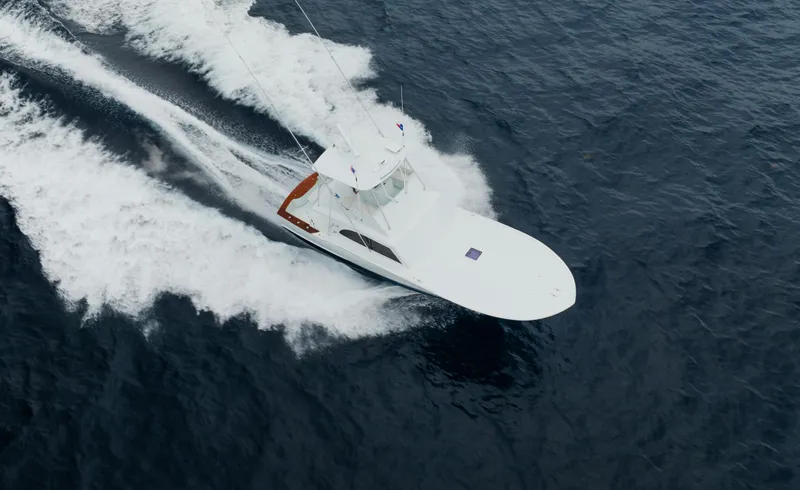 Sea Angel Yacht Photos Pics Scarborough 46 Convertible 1980 yacht cruising swiftly on open water, aerial view.