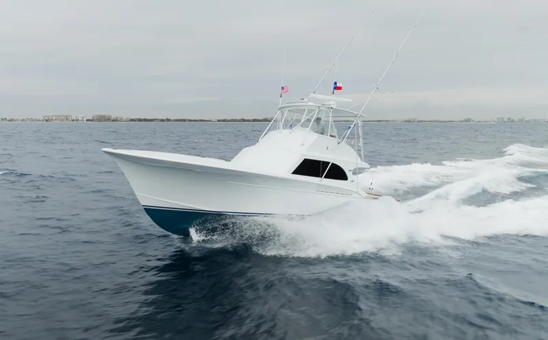 Sea Angel Yacht Photos Pics 1980 Scarborough 46 Convertible yacht cruising on open water.