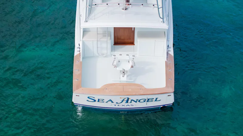 Sea Angel Yacht Photos Pics 1980 Scarborough 46 Convertible yacht "Sea Angel" on clear blue water.