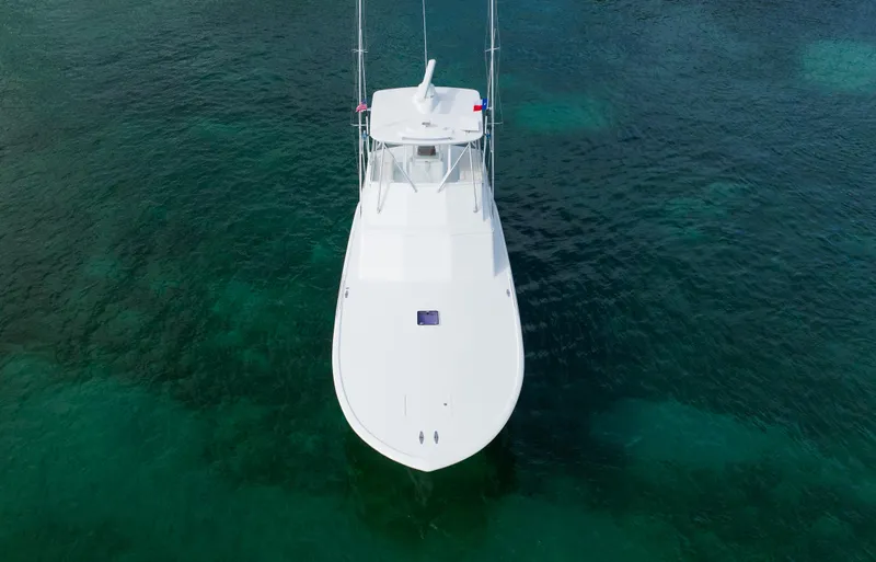 Sea Angel Yacht Photos Pics Aerial view of 1980 Scarborough 46 Convertible boat on clear water.