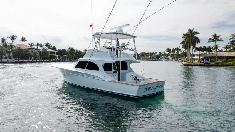 Sea Angel Yacht Photos Pics 1980 Scarborough 46 Convertible yacht cruising in a scenic waterfront setting.