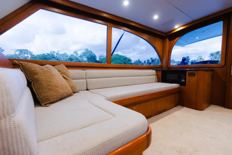 Sea Angel Yacht Photos Pics Interior of 1980 Scarborough 46 Convertible yacht with plush seating and large windows.