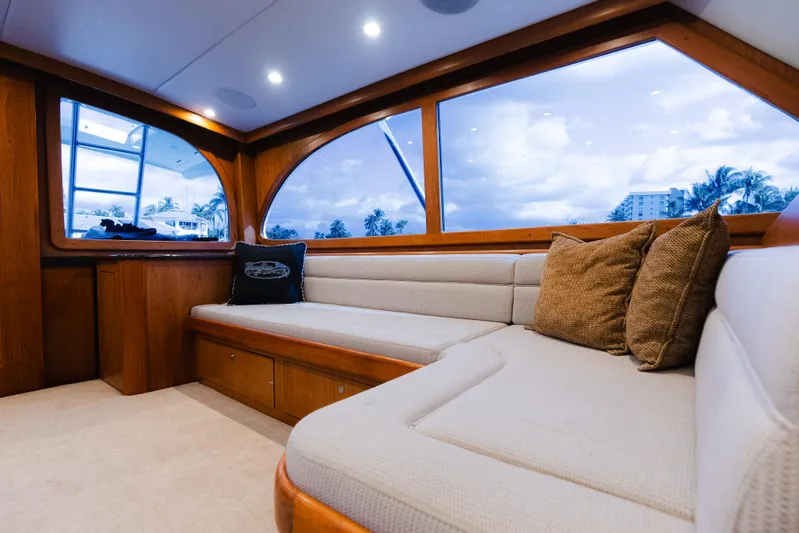 Sea Angel Yacht Photos Pics Luxurious interior of 1980 Scarborough 46 Convertible yacht with plush seating and scenic windows.