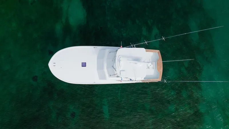 Sea Angel Yacht Photos Pics Overhead view of 1980 Scarborough 46 Convertible yacht on clear green water.