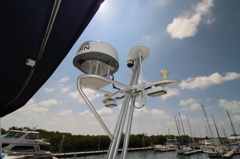 Gypsy Yacht Photos Pics Radar and antenna equipment on a 2000 Ricker 42 Classic yacht, docked at a marina.