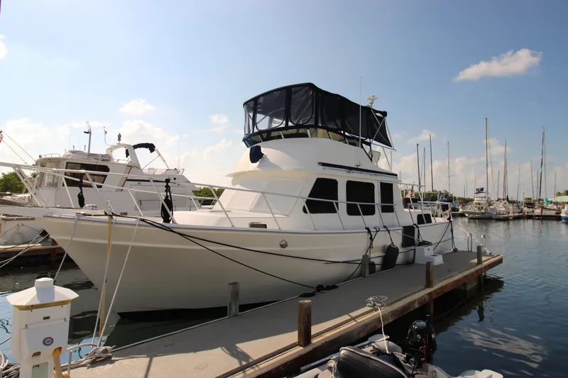 Gypsy Yacht Photos Pics 2000 Ricker 42 Classic yacht docked at marina under clear blue sky.