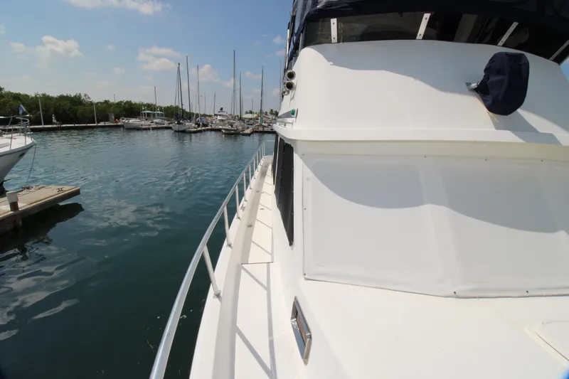 Gypsy Yacht Photos Pics Side view of a 2000 Ricker 42 Classic yacht docked in a marina.