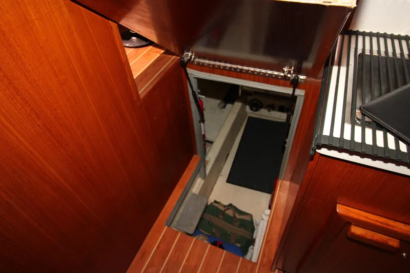 Gypsy Yacht Photos Pics Engine room access on 2000 Ricker 42 Classic yacht with wooden interior.