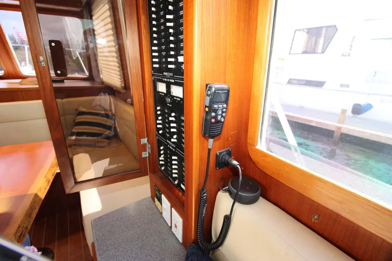 Gypsy Yacht Photos Pics Interior of 2000 Ricker 42 Classic yacht with control panel and seating area.