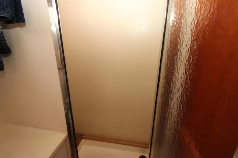 Gypsy Yacht Photos Pics Shower area inside 2000 Ricker 42 Classic boat with textured glass door.