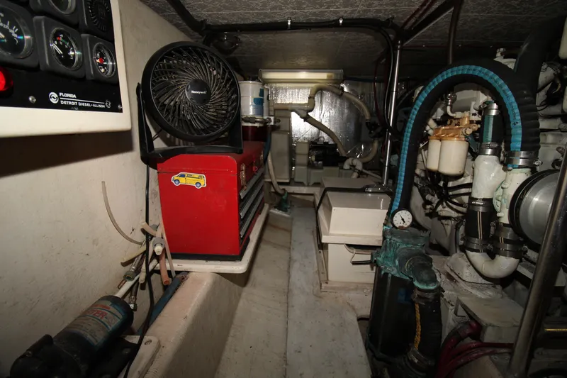 Gypsy Yacht Photos Pics Engine room of a 2000 Ricker 42 Classic boat with tools and equipment.