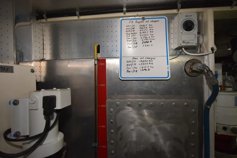 Almost Perfect Yacht Photos Pics Engine room of 2006 Kadey-Krogen North Sea Widebody with maintenance log and equipment.