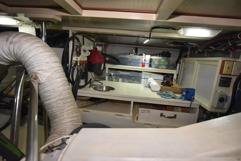 Almost Perfect Yacht Photos Pics Engine room of 2006 Kadey-Krogen North Sea Widebody with tools and equipment.