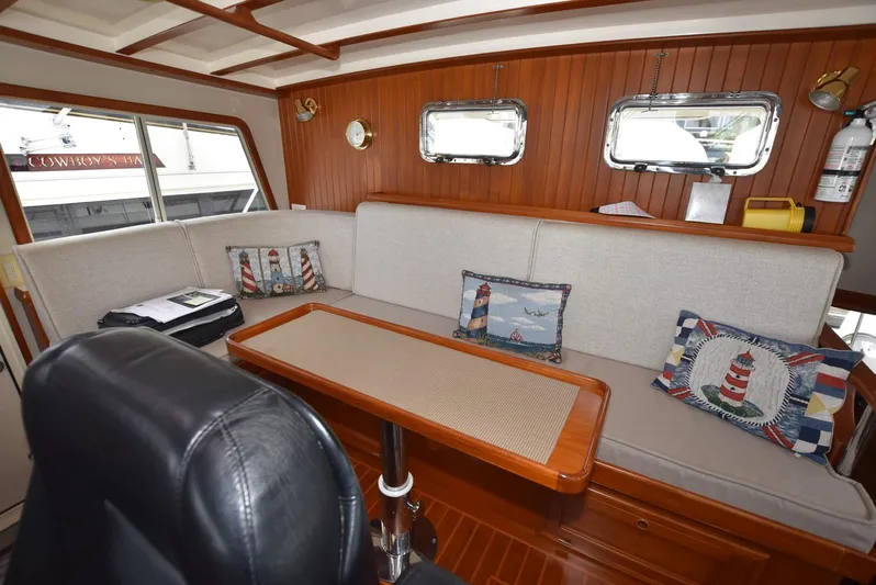 Almost Perfect Yacht Photos Pics Interior of 2006 Kadey-Krogen North Sea Widebody with cozy seating and nautical decor.