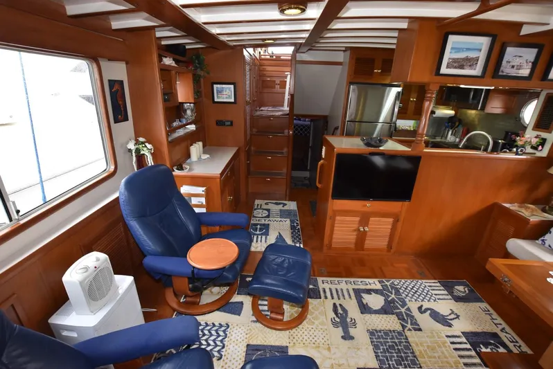 Almost Perfect Yacht Photos Pics Interior of 2006 Kadey-Krogen North Sea Widebody yacht with cozy seating and nautical decor.