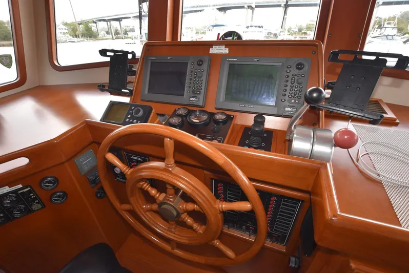 Almost Perfect Yacht Photos Pics 2006 Kadey-Krogen North Sea Widebody helm with wooden wheel and navigation instruments.